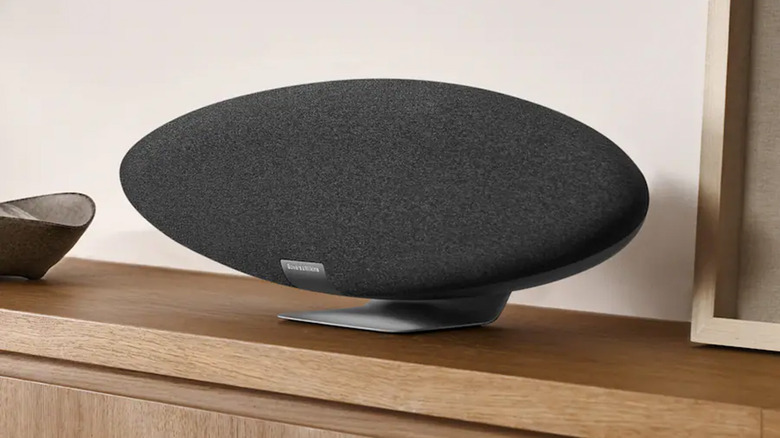 The Bowers & Wilkins Zeppelin Pro wireless speaker on a minimalist wood table.