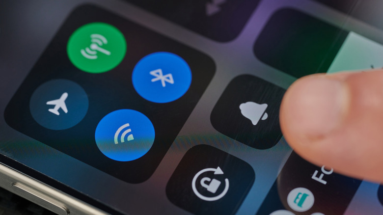 The iOS Control Center menu displayed on a smartphone screen.
