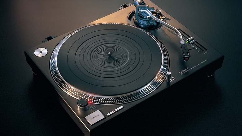Top-down view of a Technics direct-drive turntable showing the platter and tonearm.