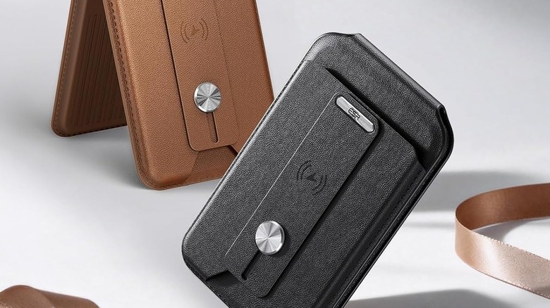 Two MagSafe wallets in black and brown leather, with one functioning as a phone stand.