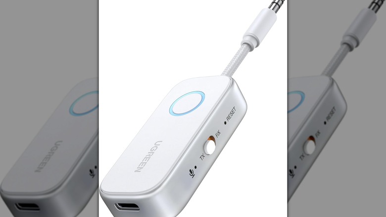 A compact UGreen Bluetooth transmitter designed for 3.5mm audio jacks.