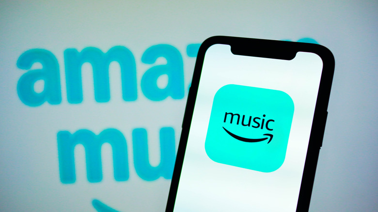 The Amazon Music logo and app interface on a smartphone screen.