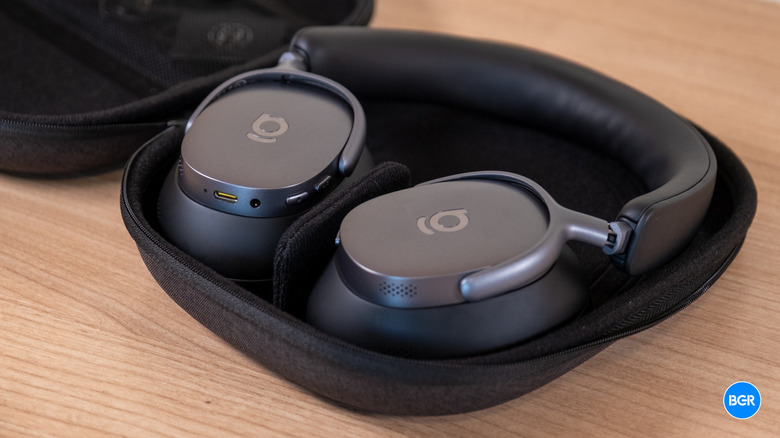The Baseus XH1 headphones folded inside their compact carrying case.