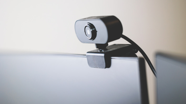 Close-up of a webcam mounted to the top of a desktop PC monitor.