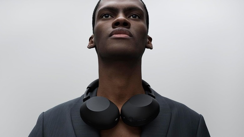 A man looking relaxed while wearing the noise-canceling Sony WH-1000XM6.
