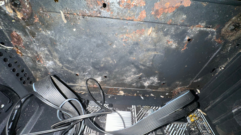 Internal PC components showing visible signs of rust and environmental corrosion.