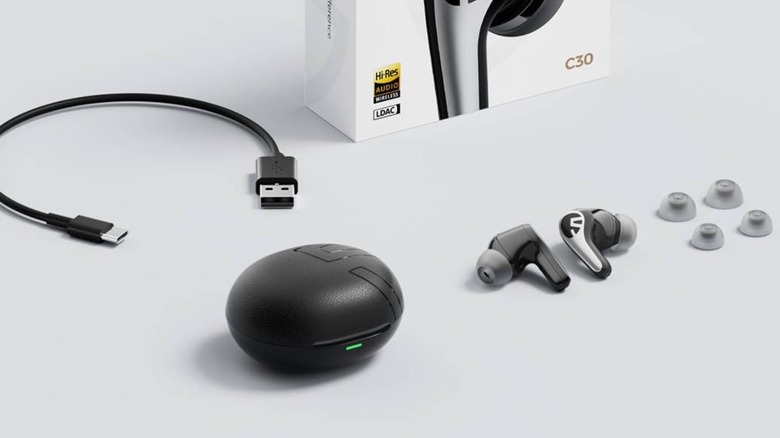 The Soundpeats C30 earbuds and included accessories arranged on a clean gray background.