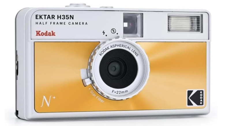 A sage green Kodak Ektar H35N half-frame film camera against a white background.