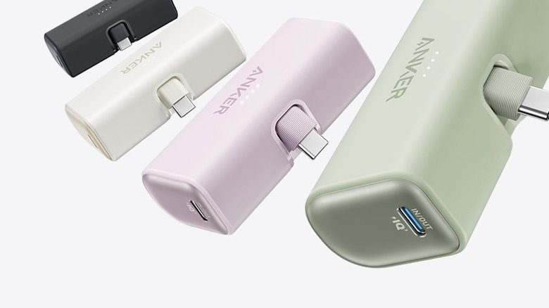 A group of Anker Nano power banks displayed in various colors including blue, pink, and white.