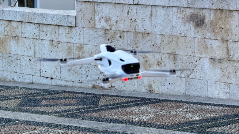 Antigravity A1 drone hovering low to the ground before a landing.