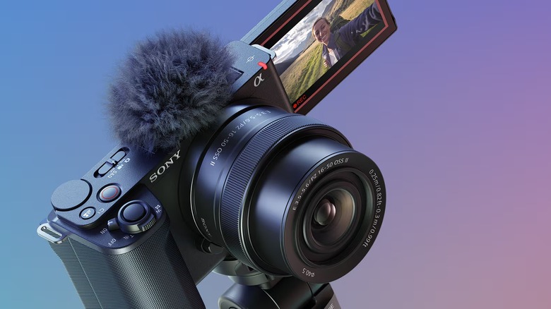 Sony ZV-E10 II mirrorless camera with the screen flipped out and a shotgun microphone attached.