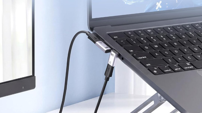 A laptop side profile featuring a plugged-in Right Angle USB-C Adapter.