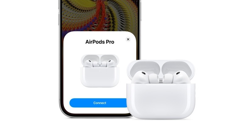 Apple AirPods Pro 3 positioned next to an iPhone 17 on a minimalist surface.