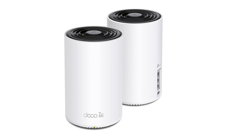 Rear view of two TP-Link Deco AXE5400 units showing Ethernet and USB ports.
