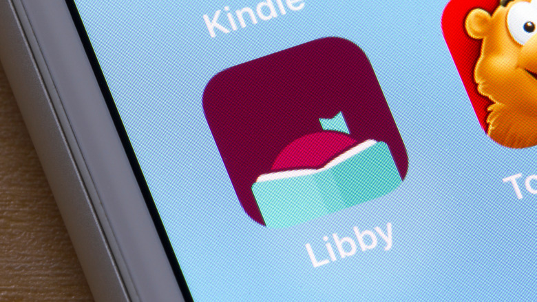 The Libby app icon displayed on an iPhone screen, highlighting its library-sharing functionality.
