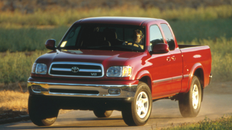 Side profile of a red 2000 Toyota Tundra Access Cab.