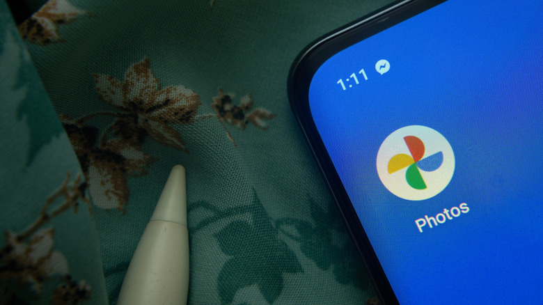 Close-up of the Google Photos app icon on a smartphone screen.