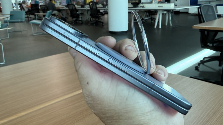 A person holding the Google Pixel 10 Pro Fold to demonstrate its size and build.