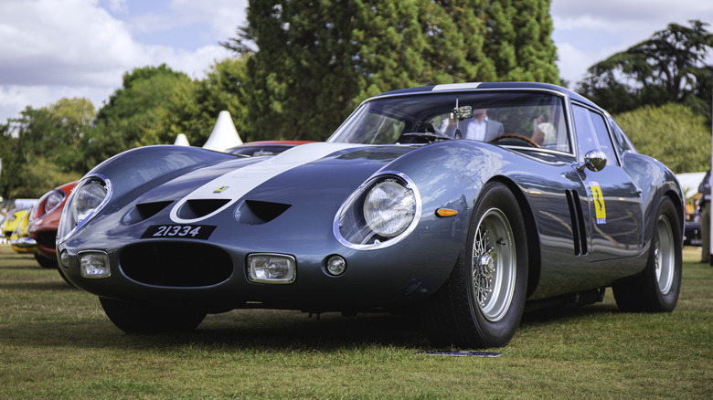 A classic red Ferrari 250 GTO in pristine condition.