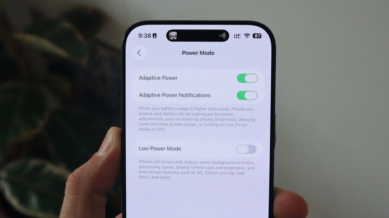 iPhone screen displaying advanced battery health and adaptive power management settings.