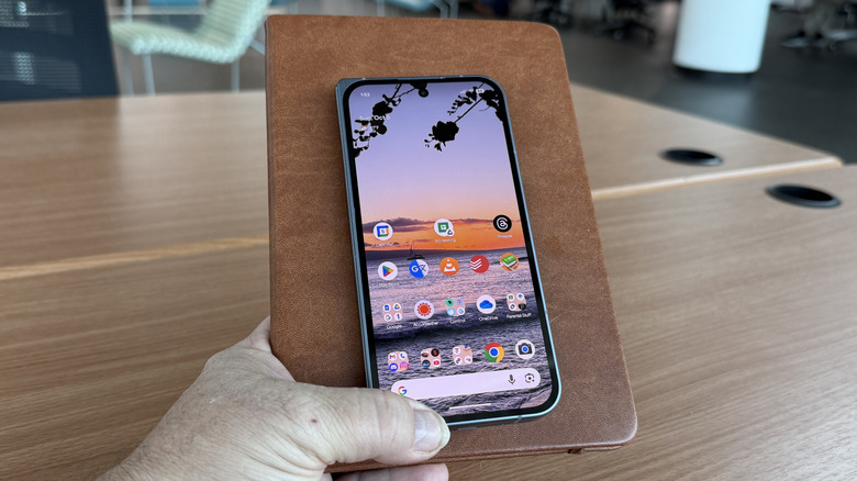 The Google Pixel 10 Pro Fold resting on a book.