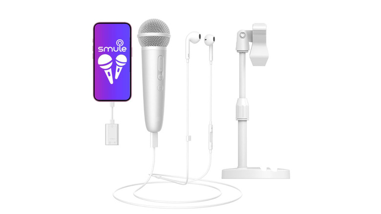 A white professional microphone with a USB-C phone adapter and earphone connection.
