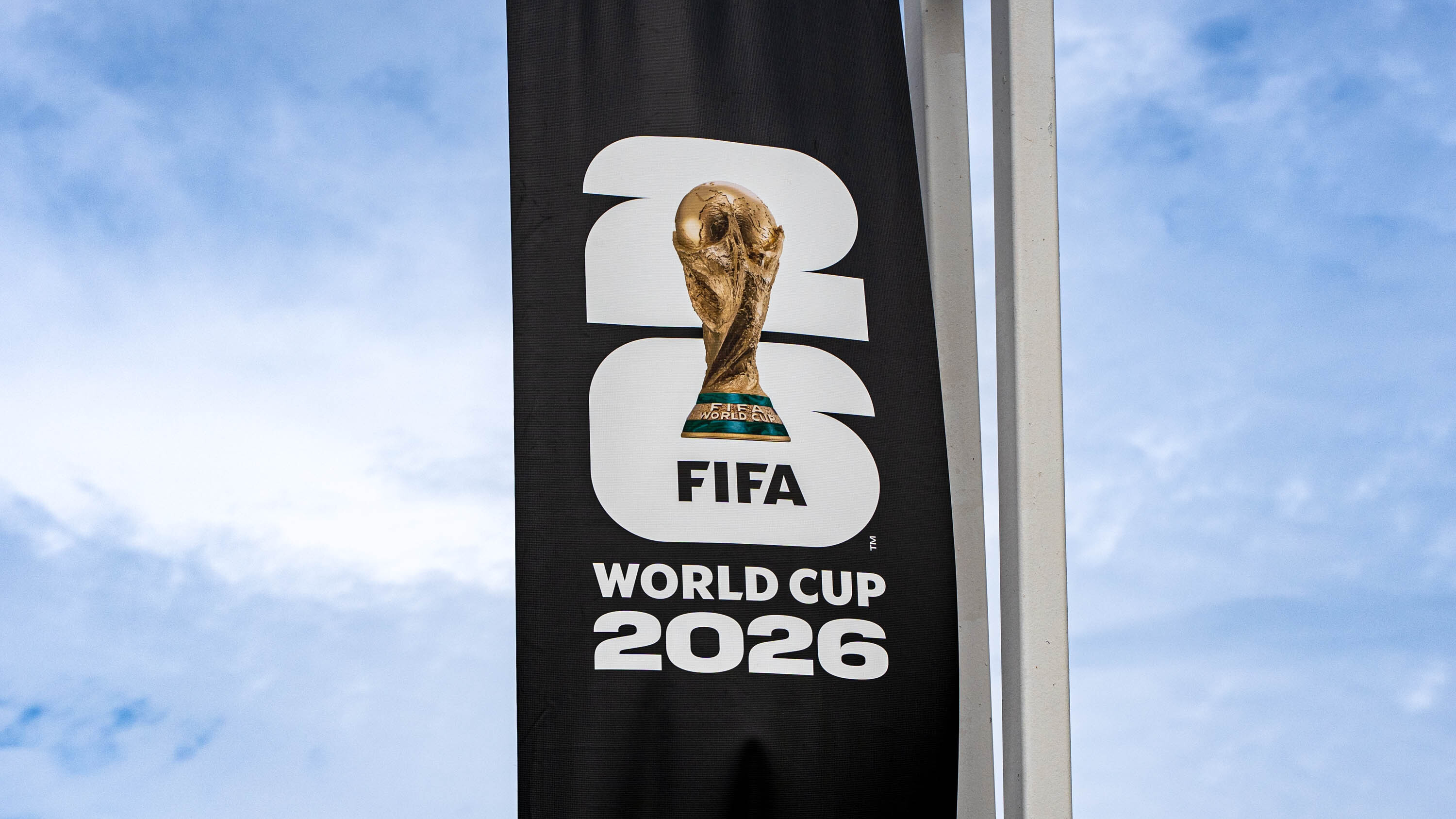 Action shot of professional soccer players competing during an international tournament.