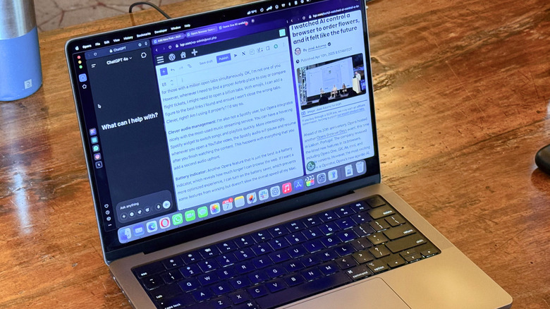 A MacBook Pro on a desk running the Opera One browser in Split View.