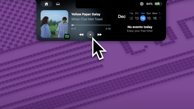 Close-up of a MacBook notch area showing the Boring Notch activity hub.