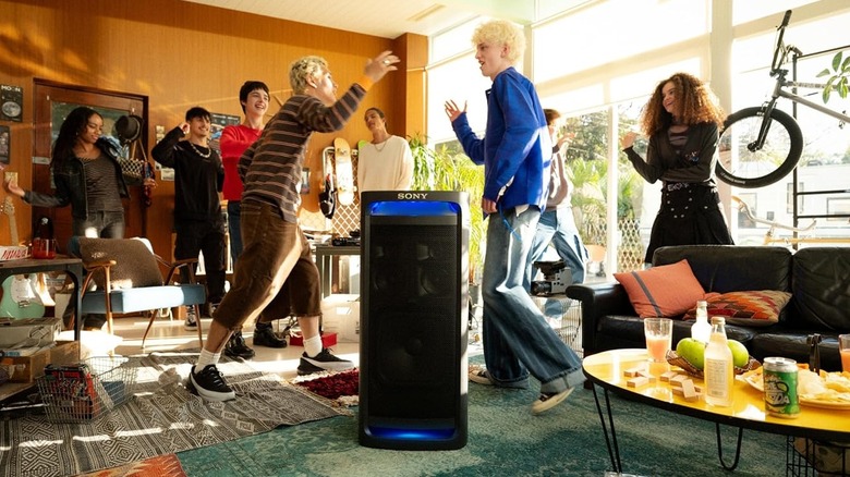 The Sony ULT Tower 9 illuminated in a party environment.