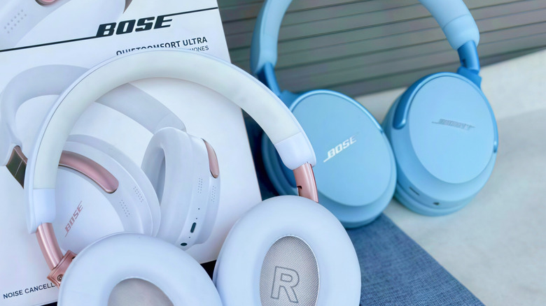 Bose headphones positioned next to their retail product box.