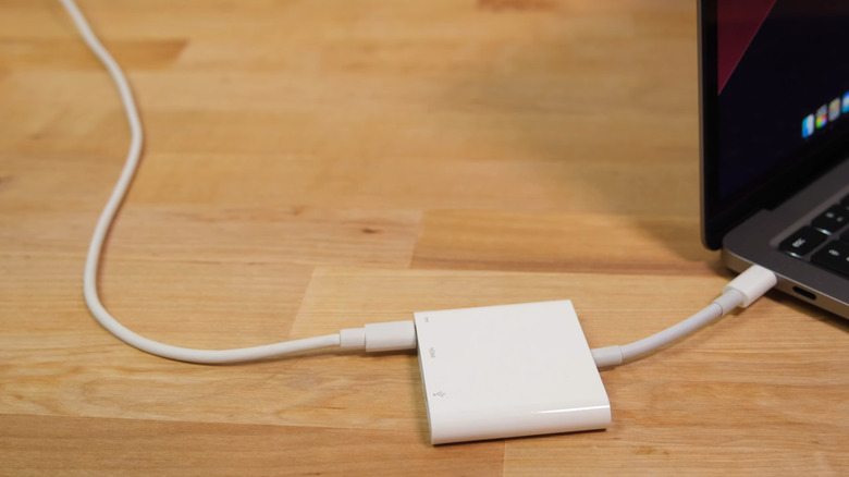 A multi-port USB-C adapter connected to a device to expand connectivity.
