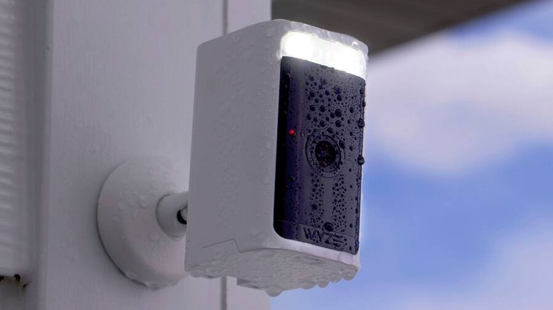 A Wyze Battery Cam Pro outdoor security camera installed on a building facade.