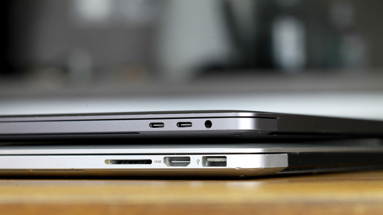 Side-by-side comparison of USB-C and Thunderbolt ports on two different MacBook models.