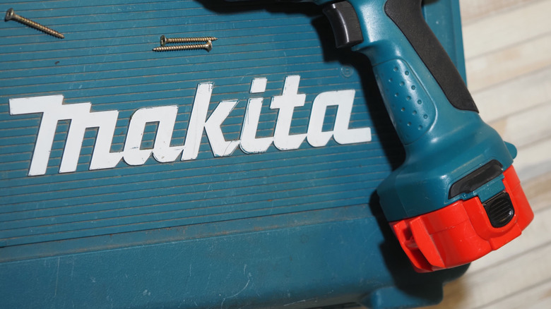 A close-up view of a Makita nickel-based battery pack showing the vertical contact stem.