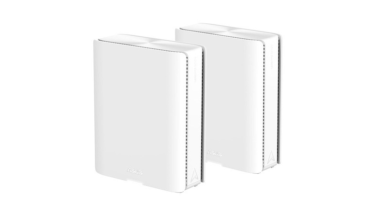 Two black ASUS ZenWiFi BQ16 mesh routers with a premium metallic finish.