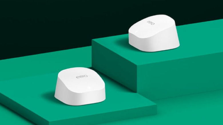 Two white Eero 6 mesh router units sitting side by side.