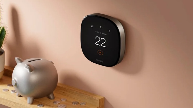 The Ecobee Smart Thermostat Premium mounted on a wall in a clean, modern home environment.