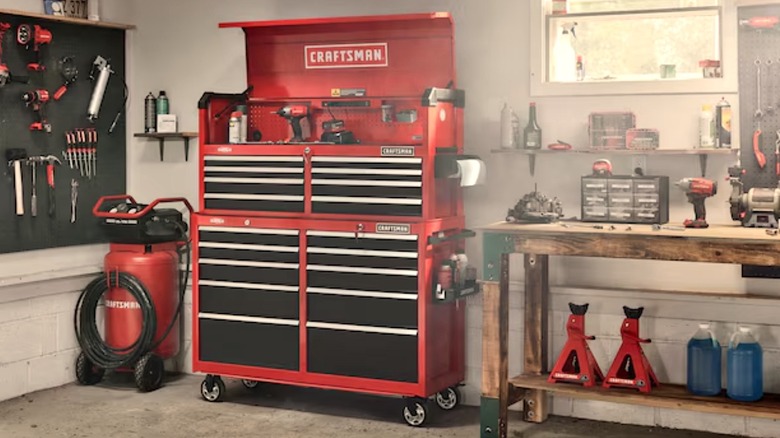 A red Craftsman 2000 Series 10-drawer rolling tool cabinet in a garage setting.