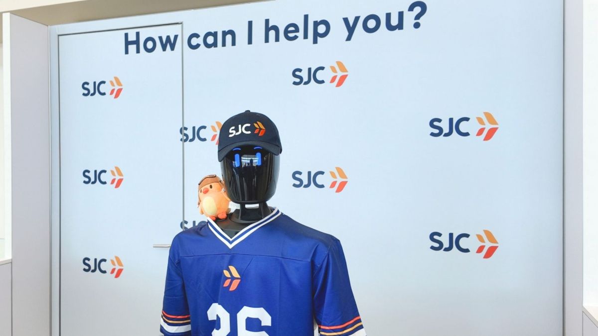 Close-up of the IntBot humanoid robot featuring social intelligence sensors for airport navigation.