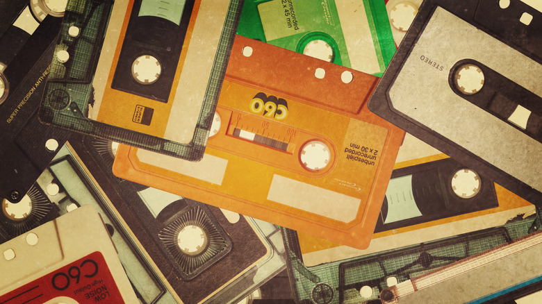 A detailed poster collage featuring dozens of cassette tapes from different eras.