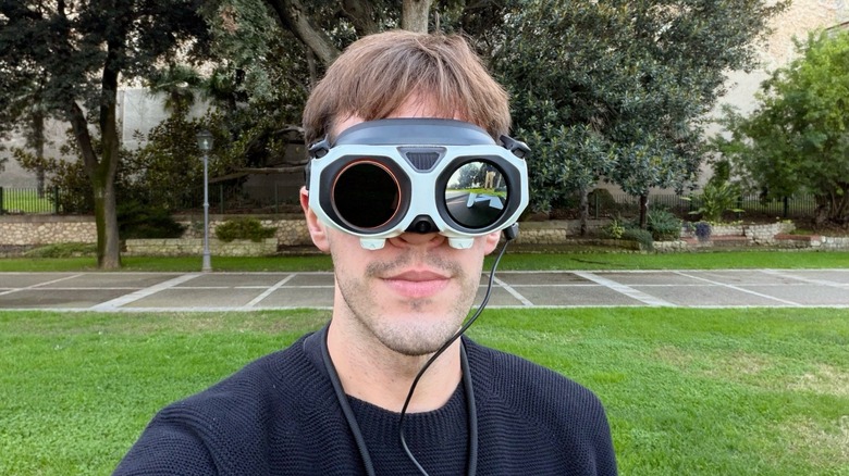 A person wearing the Antigravity Vision Goggles designed for immersive FPV flight.