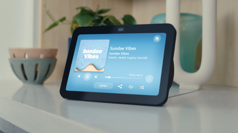 An Amazon Echo Show on a table, used for voice-controlled interaction.