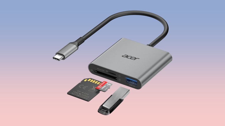 A sleek silver Acer 3-in-1 USB-C card reader displayed against a neutral gradient background.