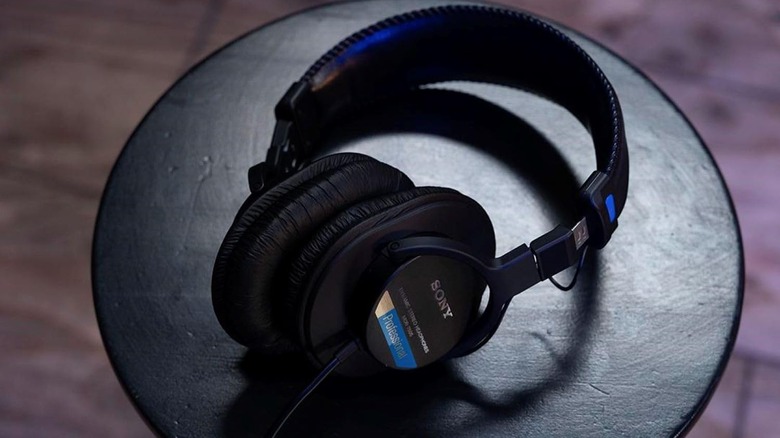 Sony MDR-7506 professional monitor headphones resting on a black surface.