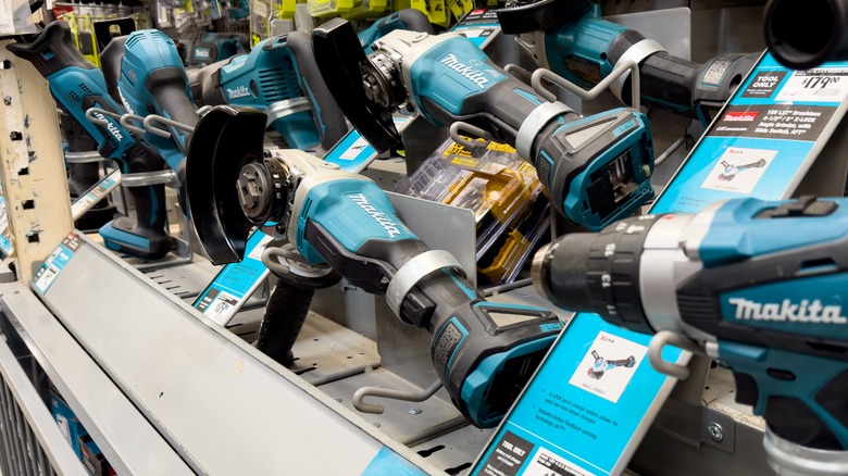 A wide variety of Makita power tools on display at a retail store.