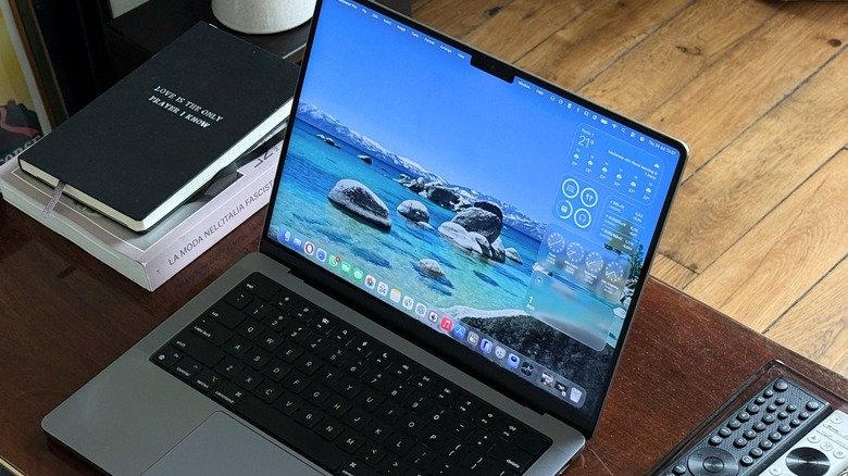 A MacBook Pro showing a stable macOS environment, representing Apple's cross-platform focus on software refactoring.