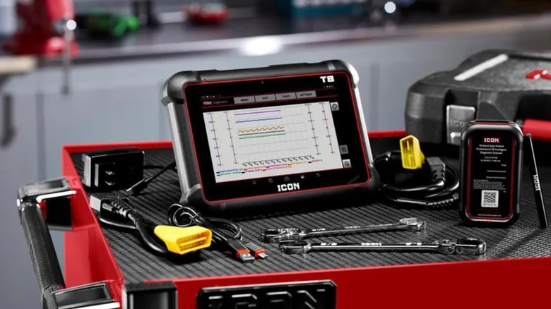 The Icon T8 diagnostic scanner resting on a black professional tool cart.
