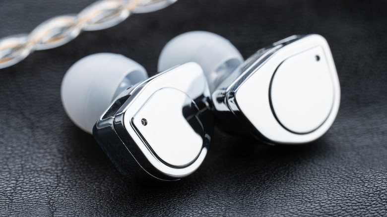 A pair of IEMs featuring thick, braided detachable cables.