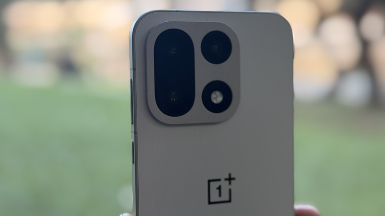 Detailed view of the circular camera island on the back of the OnePlus 15.